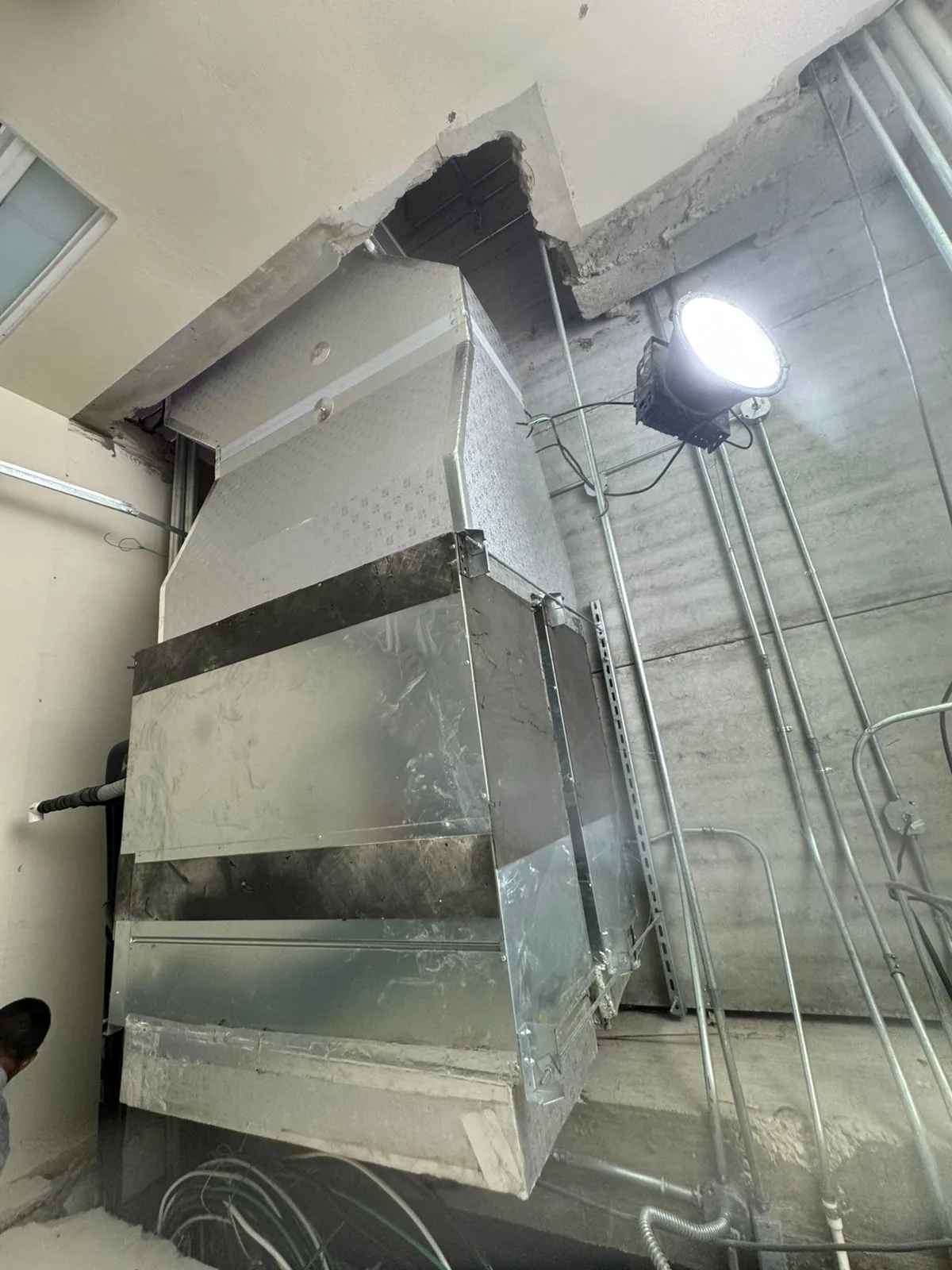 Rectangular metal ducts and connections in an unfinished interior space