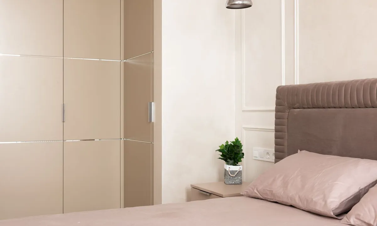 Contemporary bedroom with a plant beside the bed