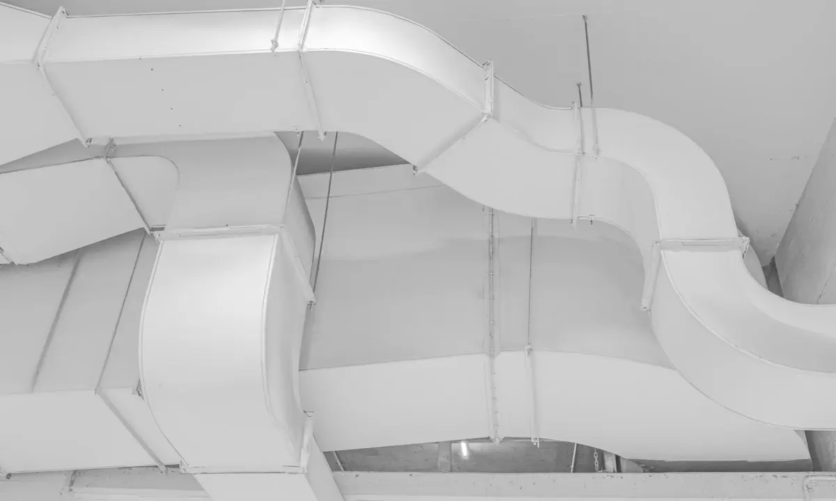 White ventilation ducts viewed from below