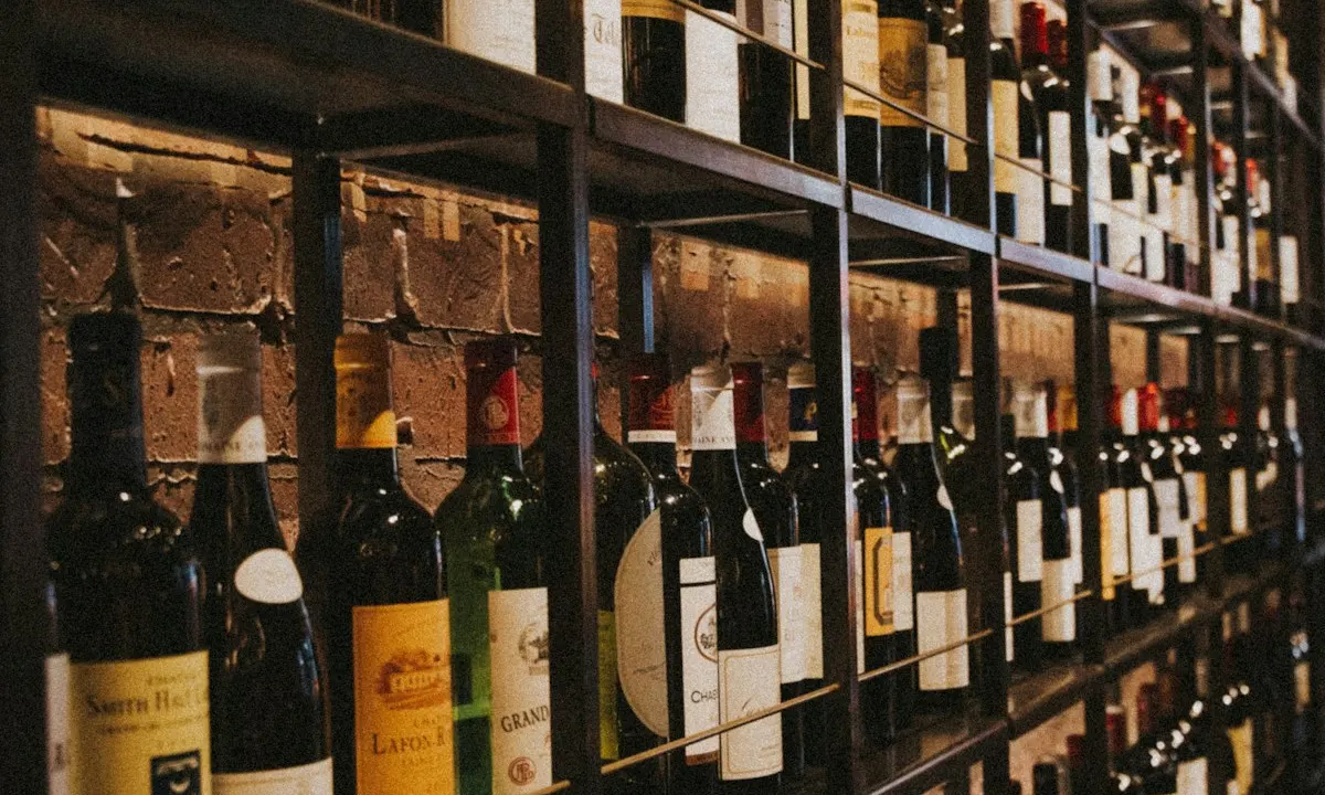 Wine bottles arranged in rows of shelves